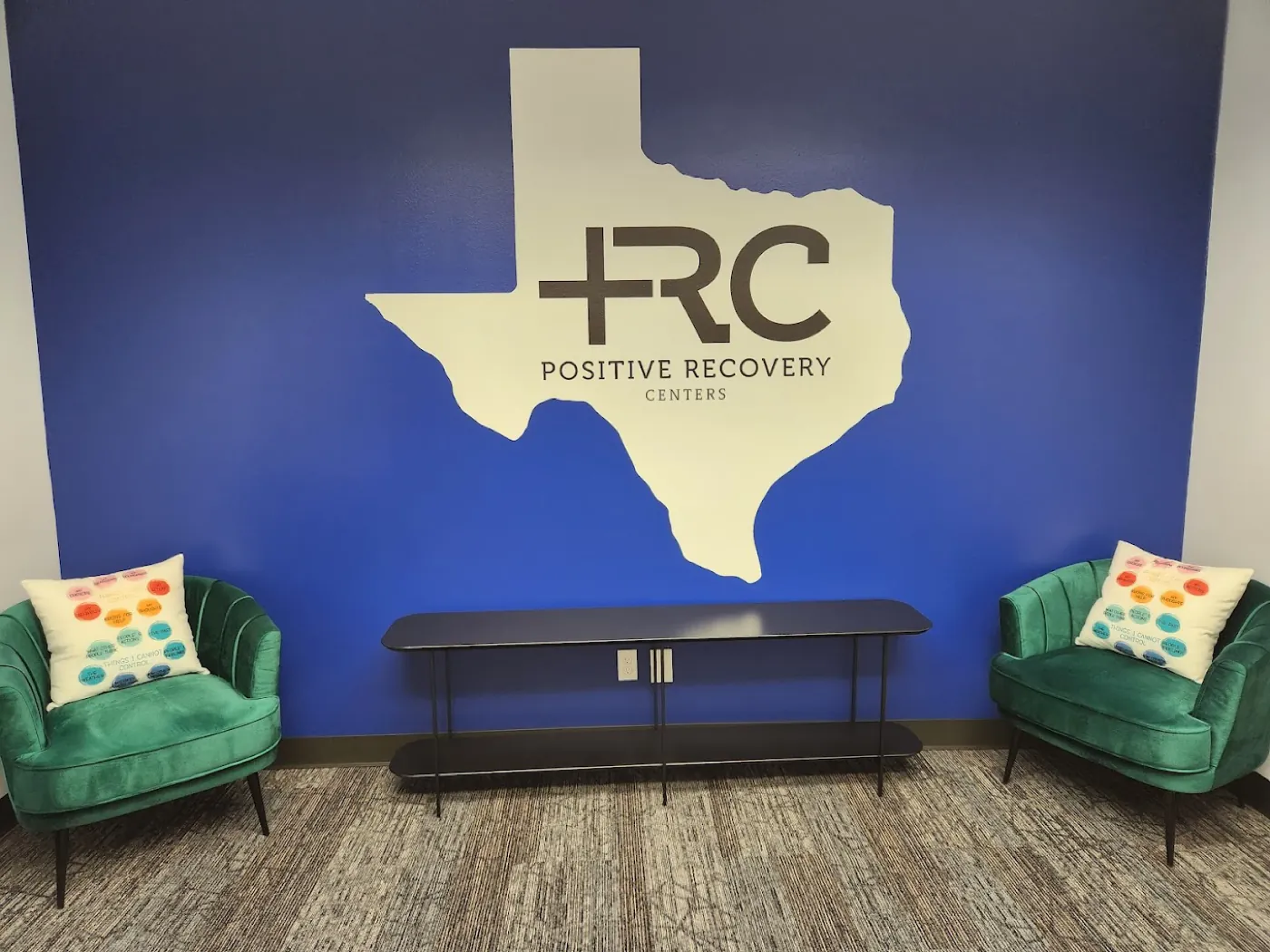 Inside the Positive Recovery Centers Conroe office, with a Texas-themed wall