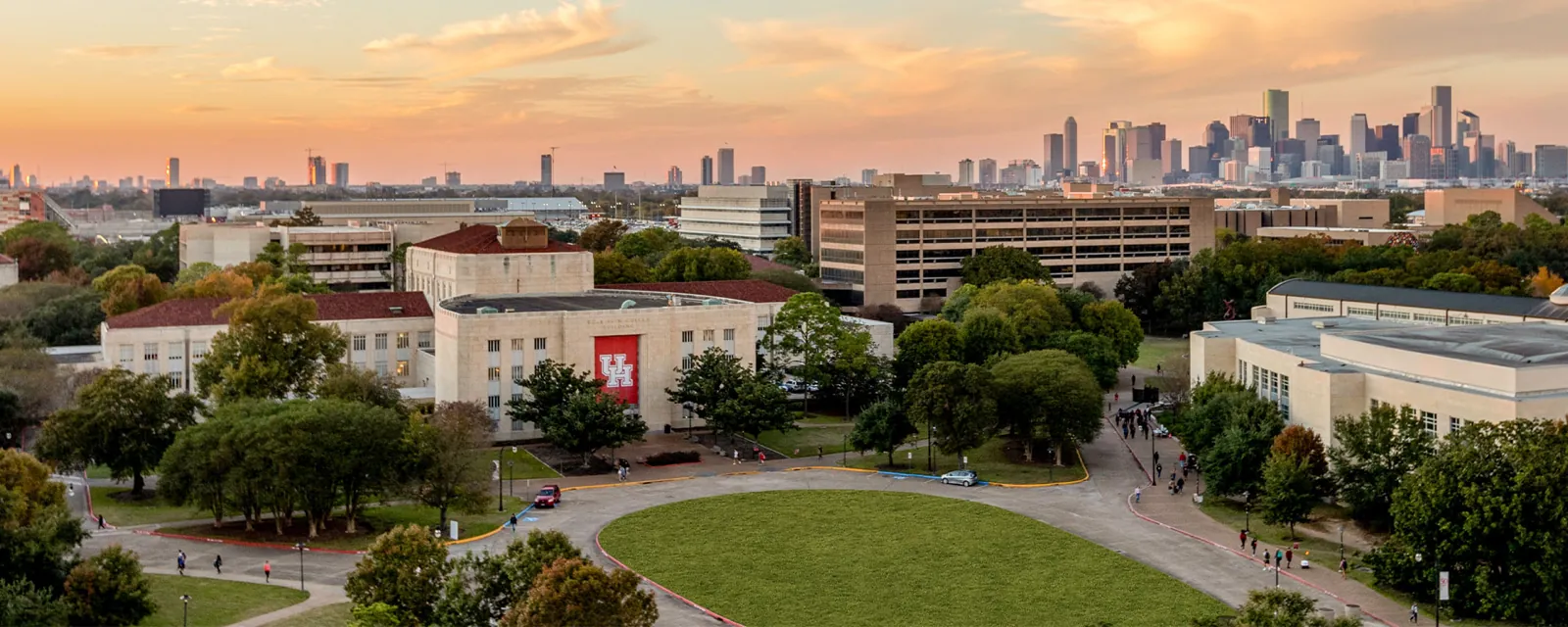 College campus with the Houston skyline at sunset